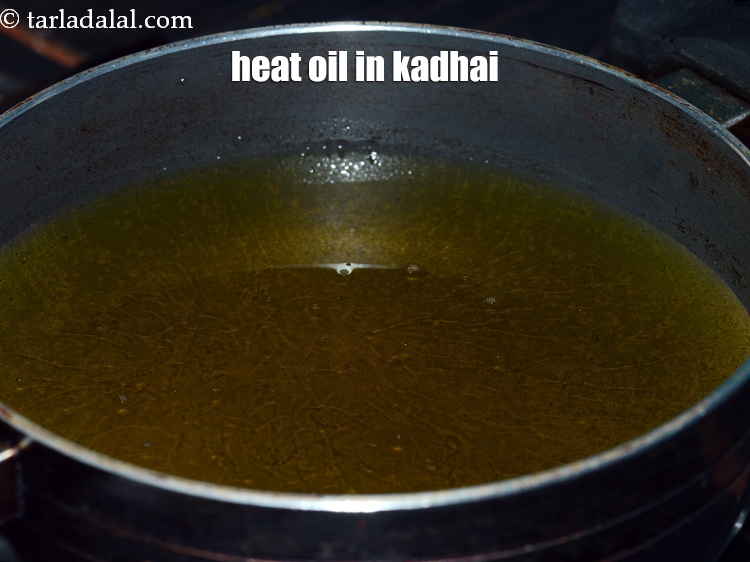 Step 17 – Heat oil in a kadhai.