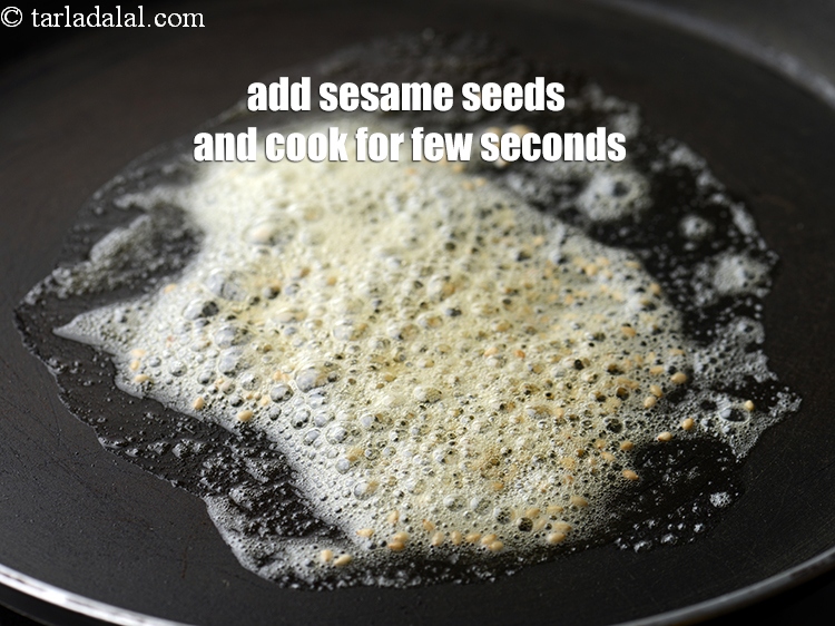 Step 20 – Add 1 tsp of <a href="https://www.tarladalal.com/glossary-sesame-seeds-til-gingelly-seeds-612i">sesame seeds (til)</a> and cook for a few seconds.