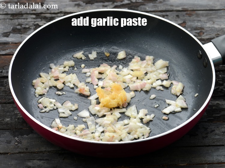 Step 15 – Add 1 tsp&nbsp;<a href="https://www.tarladalal.com/glossary-garlic-paste-lehsun-ki-paste-lahsun-ki-paste-350i">garlic (lehsun) paste</a>.&nbsp;
