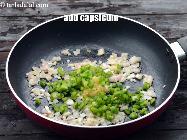 Step 16 – Add 1/2 cup&nbsp;finely&nbsp;<a href="https://www.tarladalal.com/glossary-chopped-capsicum-164i">chopped capsicum</a>.&nbsp;