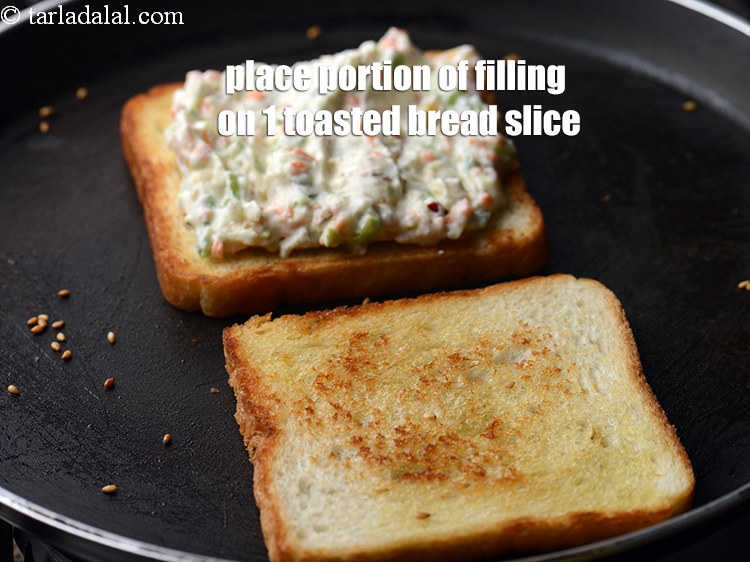 Step 23 – Place a portion of the prepared filling on 1 toasted bread slice.