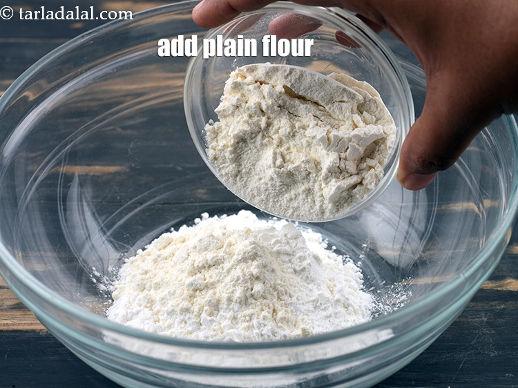 Step 4 – Add &frac14; cup <a href="https://www.tarladalal.com/glossary-plain-flour-maida-188i">plain flour (maida)</a>.