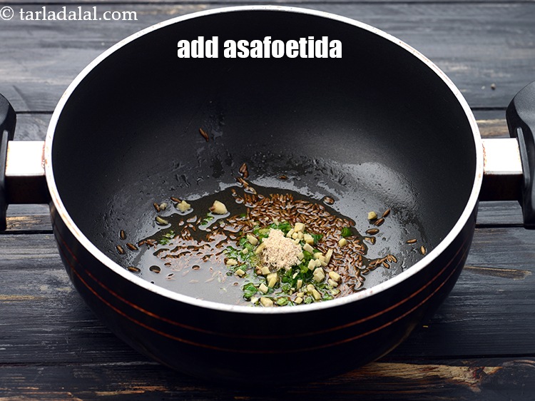 Step 21 – Add a pinch of&nbsp;<a href="https://www.tarladalal.com/glossary-asafoetida-hing-113i">asafoetida (hing)</a>.&nbsp;