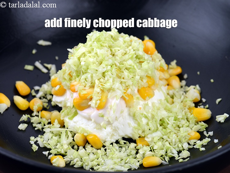 Step 7 – Add 1/4 cup finely <a href="https://www.tarladalal.com/glossary-chopped-cabbage-781i">chopped cabbage</a>.