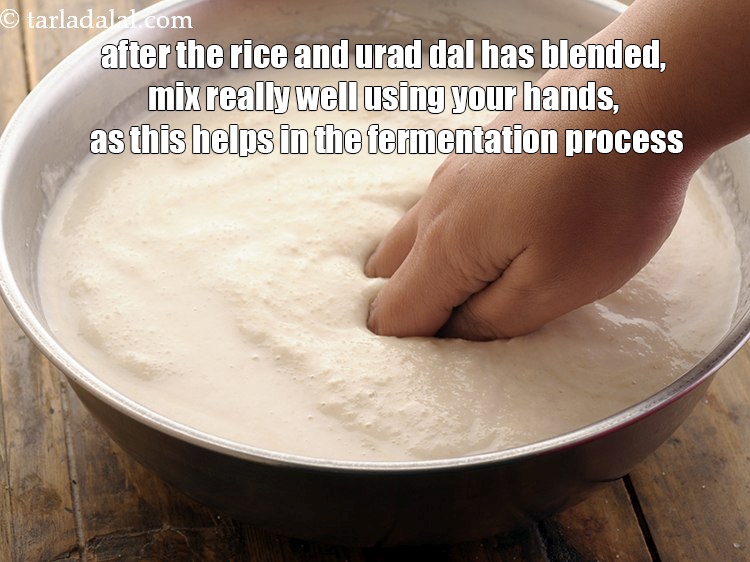 Step 10 – <p>After the rice and urad dal has blended, mix really well using your hands, as …