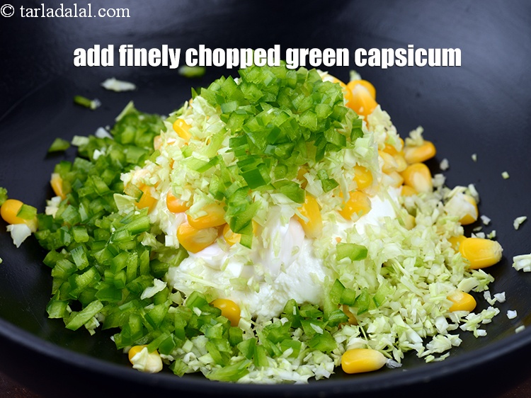 Step 8 – Add 1/4 cup finely&nbsp;<a href="https://www.tarladalal.com/glossary-chopped-capsicum-164i">chopped green capsicum</a>.