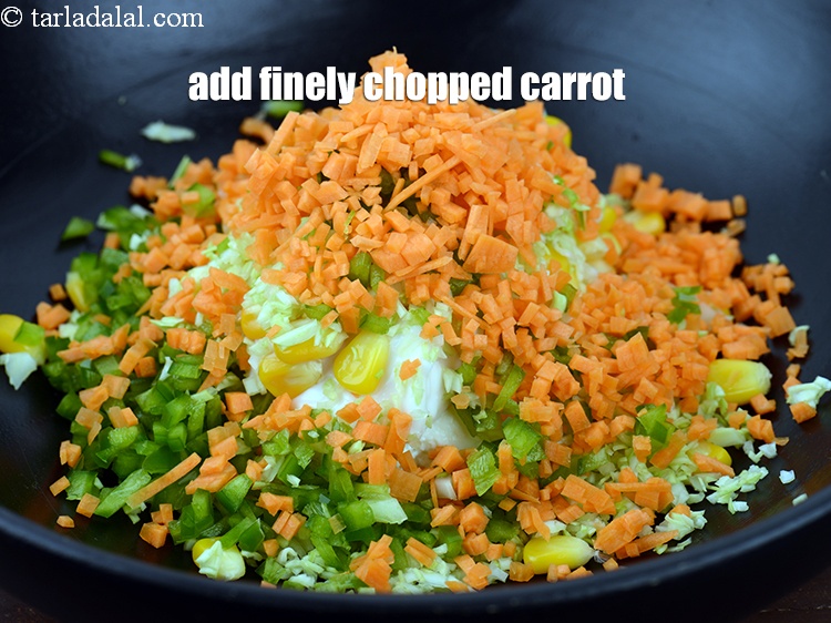 Step 9 – Add 1/4 cup finely <a href="https://www.tarladalal.com/glossary-chopped-carrot-798i">chopped carrot</a>.