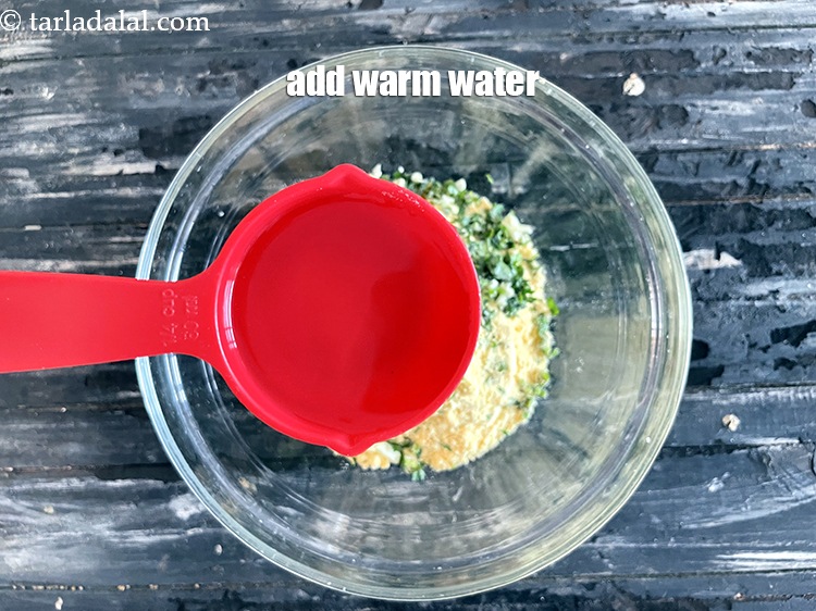 Step 11 – Add enough warm water. Add 1/2&nbsp;cup warm water plus 1 tablespoon water.