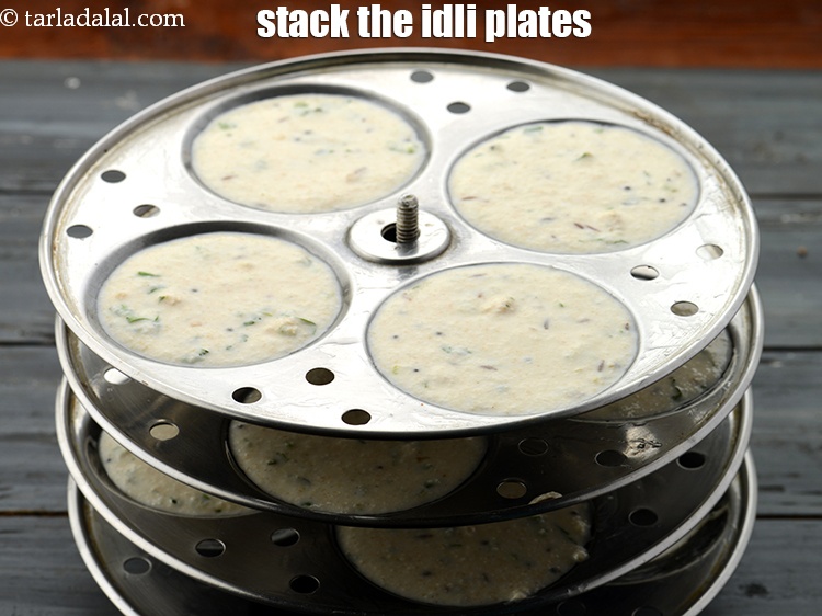 Step 36 – Once all your idli plates are filled and ready, place them one above another in …