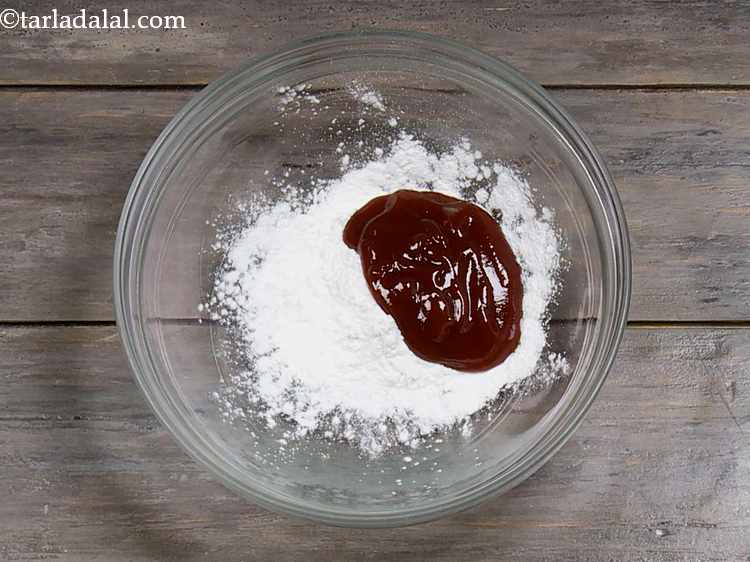 Step 2 – Now add tomato ketchup. It provides a tangy flavor to the stewed rice.