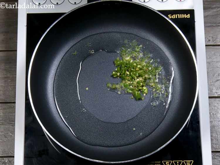 Step 11 – Heat the oil in a broad non-stick pan, add the green chillies. Adjust the amount …
