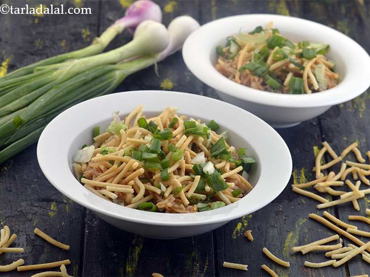 Step 17 – Top it with fried noodles and spring onion whites and greens and serve immediately. Make …