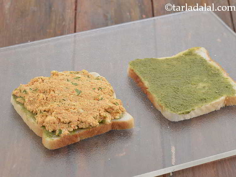 Step 11 – Place a portion of the paneer stuffing on a buttered-chutney bread slice and spread it …