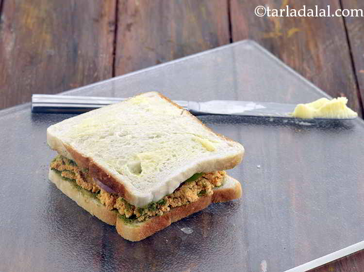 Step 14 – Sandwich it with the other buttered-chutney side facing downwards and press it lightly. Spread ? …