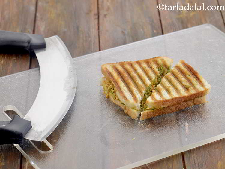 Step 16 – Cut the sandwich diagonally into 2 equal portions.