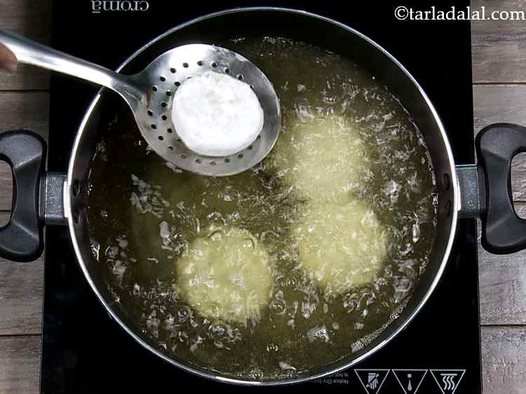 Step 18 – Heat the oil in a deep non-stick pan, and deep-fry a few tikkis at a …