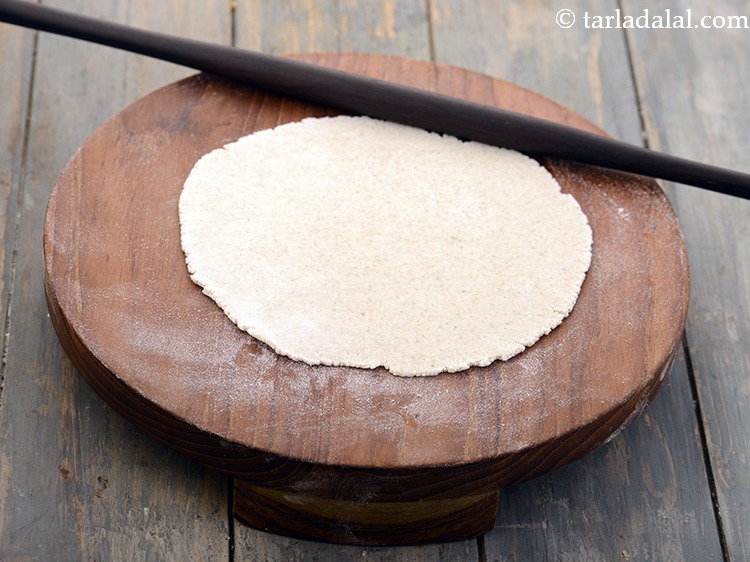 Step 16 – Roll out each portion into a 150 mm. (6&rdquo;) diameter circle using a little <a …