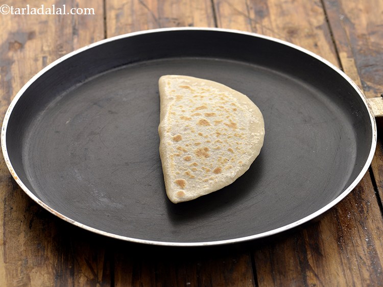 Step 20 – Heat a non-stick tava (griddle) and cook the paratha, using a little oil, till it …