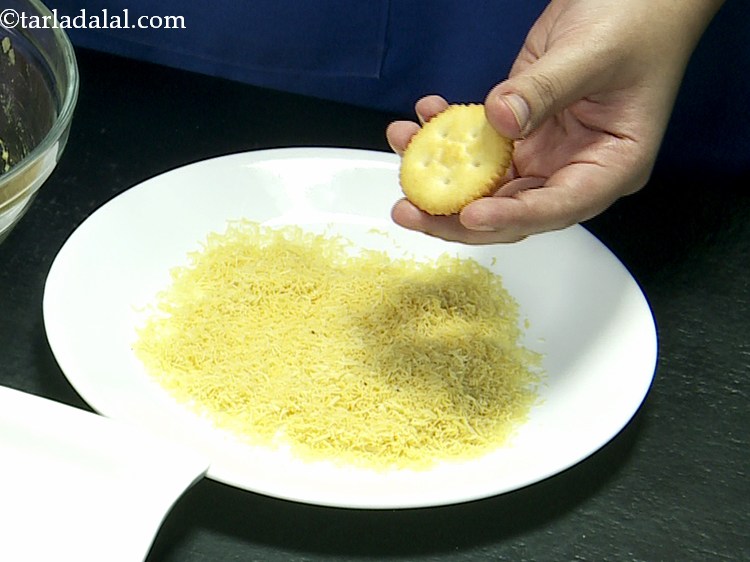 Step 12 – For making the&nbsp;<strong>Monaco Biscuit Sev Puri</strong>, place a monaco biscuit on a clean dry surface. …