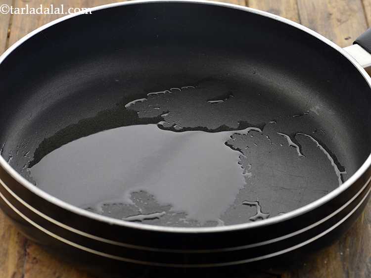 Step 15 – For the potato stuffing of&nbsp;&nbsp;<strong>Stuffed Moong Dal And Potato Rolls</strong>, heat the oil in a …