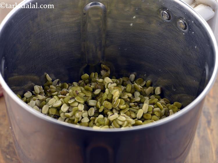 Step 6 – Transfer the soaked and drained green moong dal in a mixer jar.