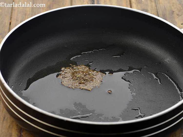 Step 16 – Once the oil is hot, add the cumin seeds.