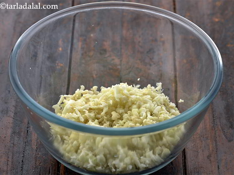 Step 9 – In a deep bowl, add <meta charset="UTF-8" />1/2 cup&nbsp;<a href="glossary-grated-cauliflower-994i">grated cauliflower</a>. Make sure you wash …