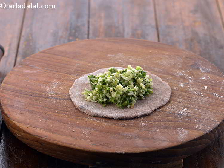 Step 20 – Place a portion of the vegetable stuffing in the centre of the circle