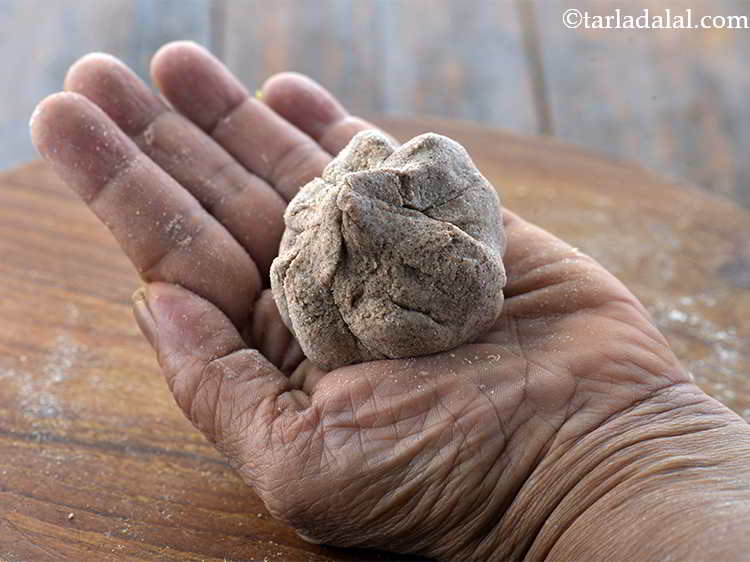 Step 21 – Bring together all the sides in the centre while pressing the stuffing down so as …
