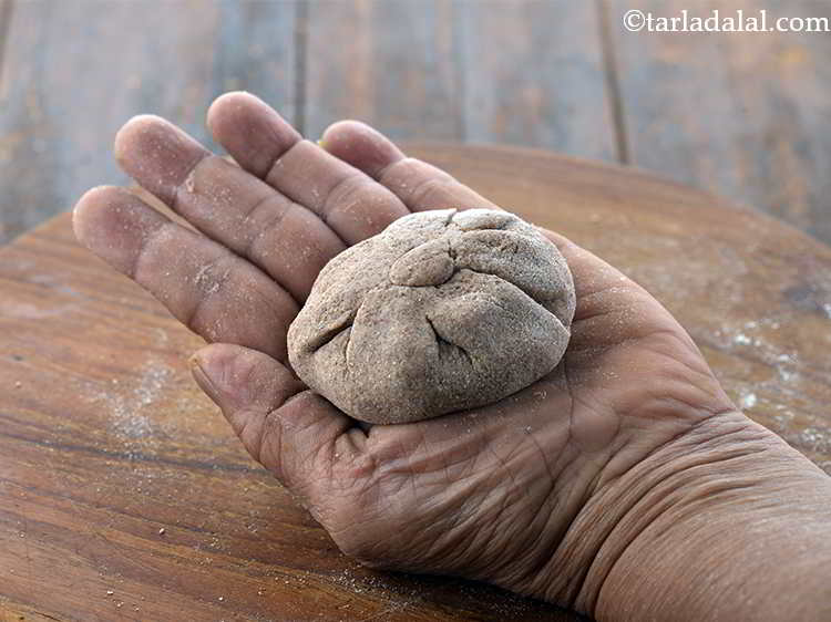 Step 22 – Bring the sides together to form a ball, remove the excess dough and seal it …