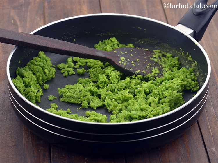Step 6 – Heat the oil in a broad non-stick pan, add the coarsely crushed green peas and …