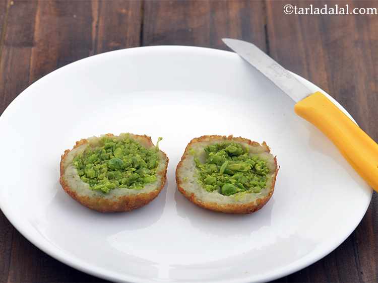 Step 22 – Place 2 tikki halves on a serving plate. You can also put whisked curd over …