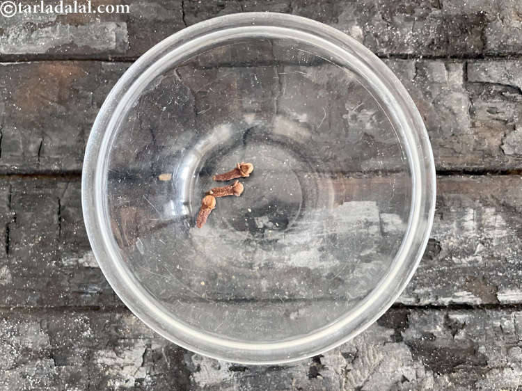 Step 9 – In a bowl put&nbsp;<meta charset="UTF-8" />3&nbsp;<a href="glossary-cloves-322i">cloves (laung / lavang)</a>.