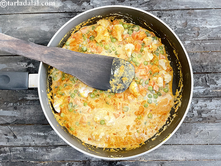 Step 16 – After adding coconut milk, ensure to cook on a slow flame and again keep stirring …