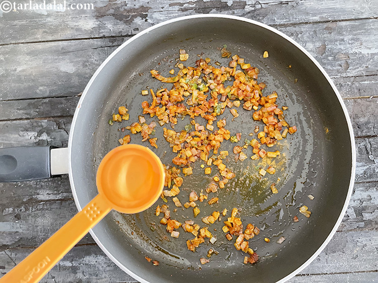 Step 26 – Sprinkle to a little water to avoid the onions from burning.