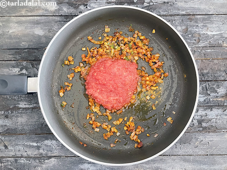 Step 27 – Add&nbsp;<meta charset="UTF-8" />1/2 cup&nbsp;fresh&nbsp;<a href="glossary-tomato-pulp-tamatar-ka-pulp-1039i">tomato pulp</a>.