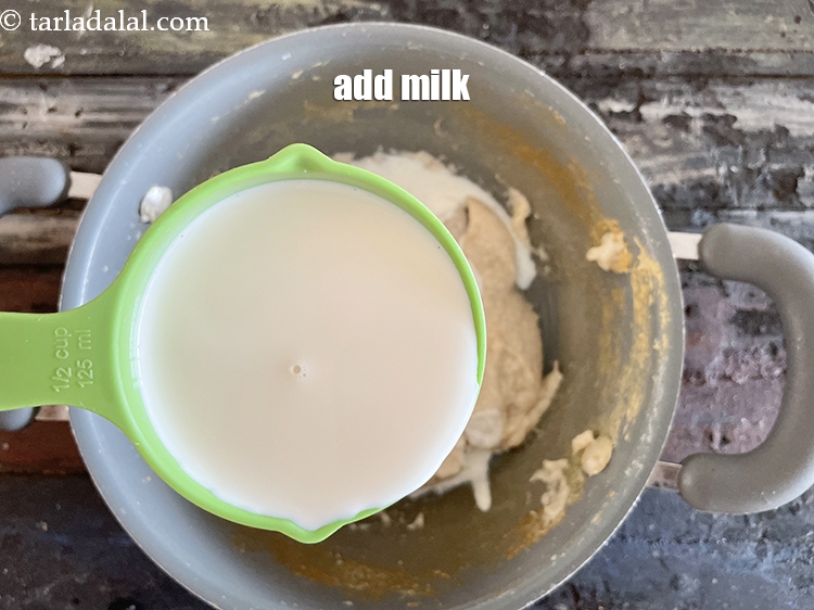 Step 13 – Add&nbsp;<meta charset="UTF-8" />1/2 cup&nbsp;<a href="glossary-milk-doodh-full-cream-milk-514i">milk</a>.