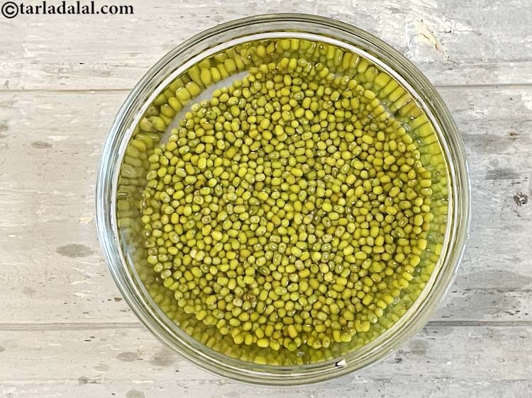 Step 4 – Wash and soak the moong in enough water in a deep bowl for 15 minutes.