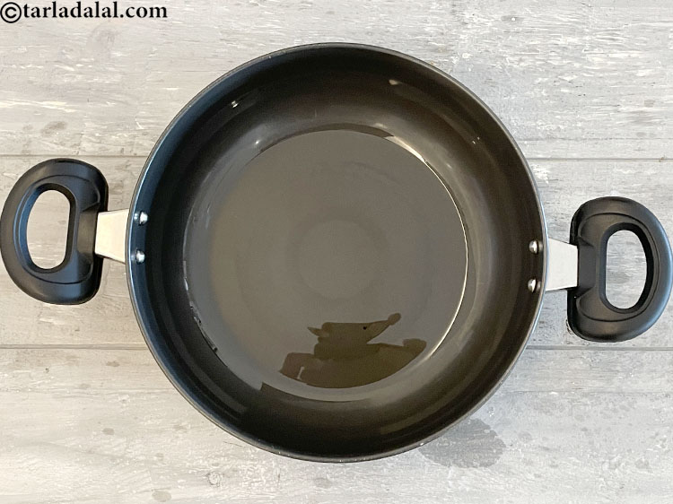 Step 10 – Heat the oil in a deep non-stick pan.