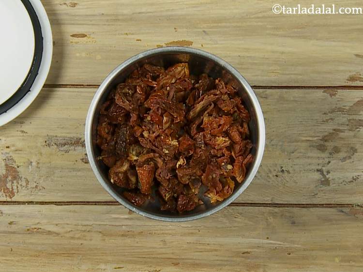 Step 11 – In a small mixer jar, take sun-dried tomatoes.