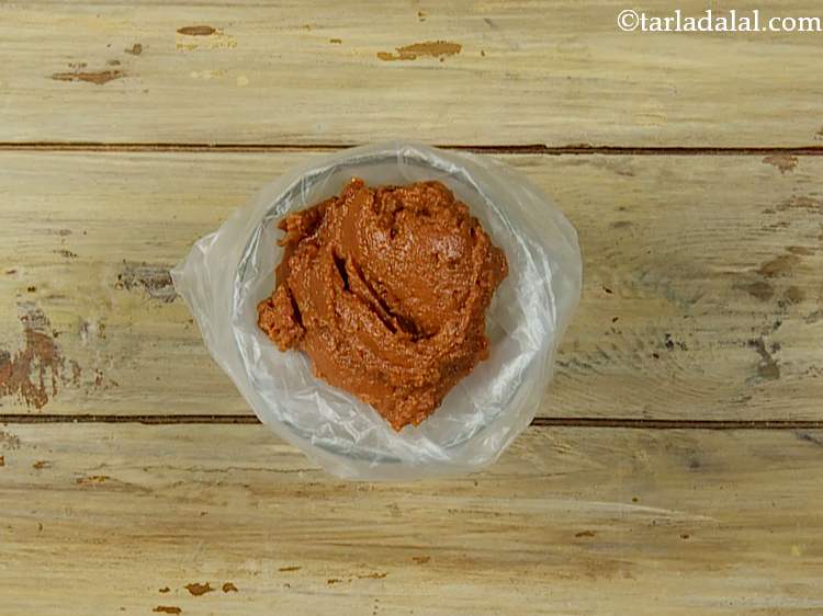 Step 15 – Transfer the sun-dried tomatoes mixture into the piping bag.