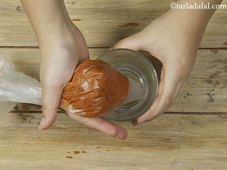 Step 16 – Squeeze the filled piping bag to get out any air bubbles. Then twist the end …