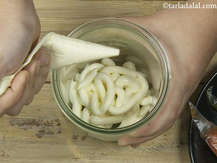 Step 21 – Take a deep glass jar, spread the cream cheese evenly at the bottom with the …