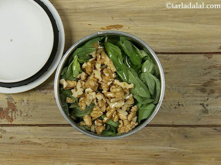 Step 3 – Now add olive oil. It is the most important ingredient of pesto.