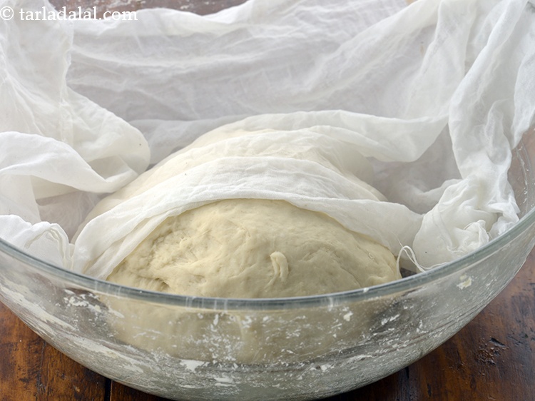 Step 37 – Cover it with a damp muslin cloth and keep aside in a warm place to …