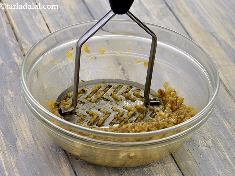 Step 15 – Mash it well using a potato masher. This will help in shaping the <strong>suran chana …
