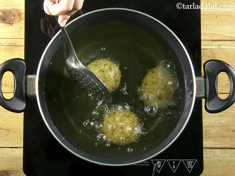 Step 23 – Heat the oil in a deep non-stick pan and carefully slide the <strong>suran chana dal …