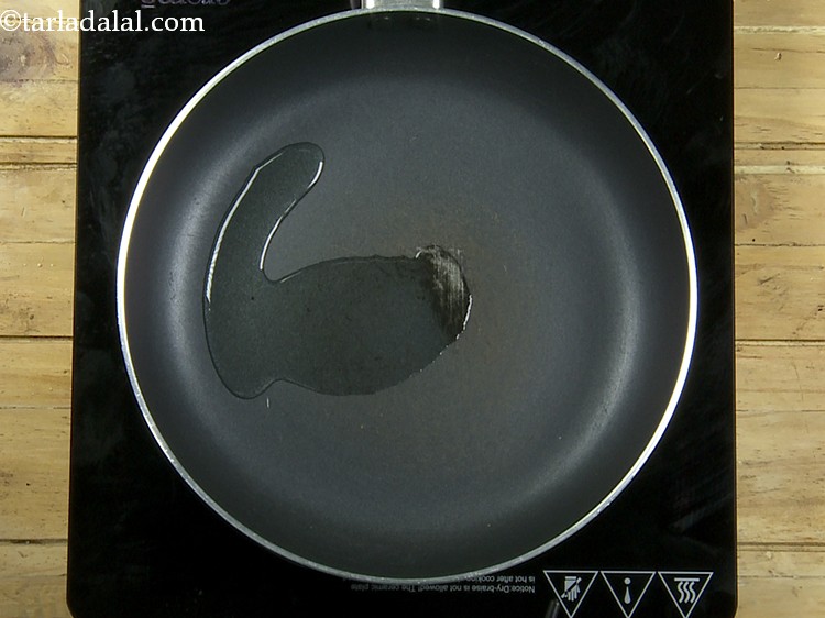 Step 7 – For preparing the mixture for <strong>suran chana dal tikki</strong>, heat the oil in the same …