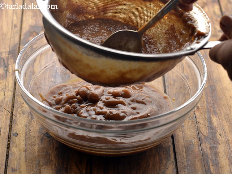 Step 10 – Sieve it using a sieve and a spoon. This will help in discarding the fibres …