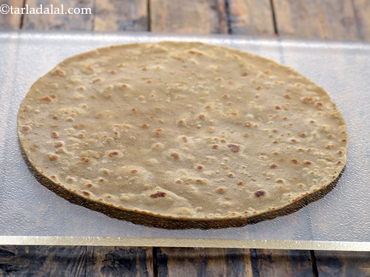 Step 39 – Place a chapati on a clean dry surface. You can also use the store bought …